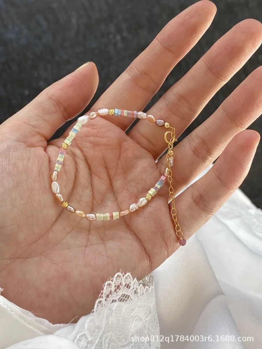 Purple freshwater pearl bracelet and necklace set with 14K gold-plated accents and irregular pearl shapes