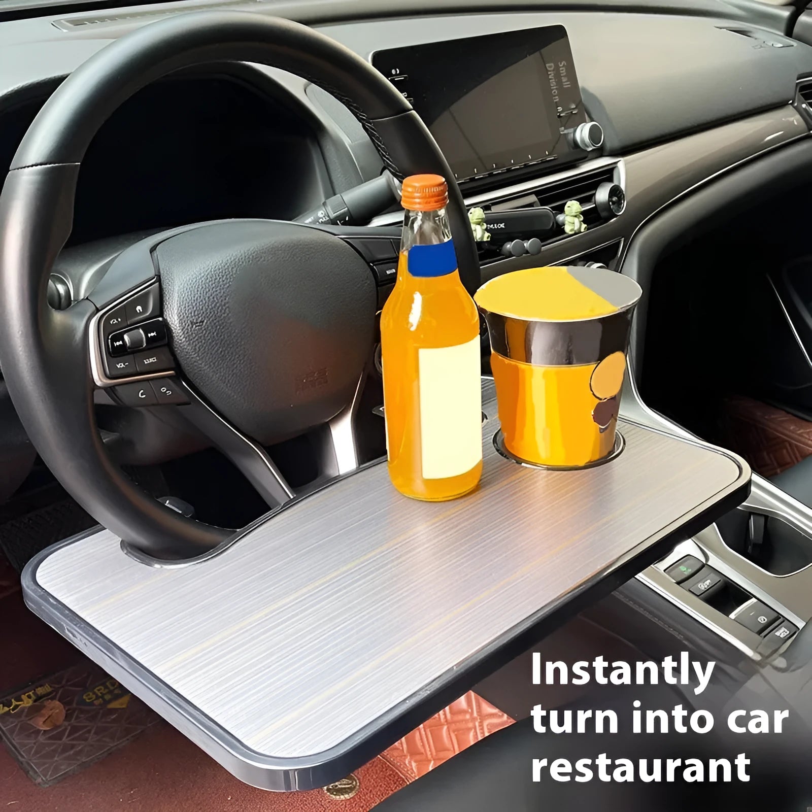 Foldable black ABS plastic car steering wheel tray with a large flat surface, shown unfolded on a steering wheel.