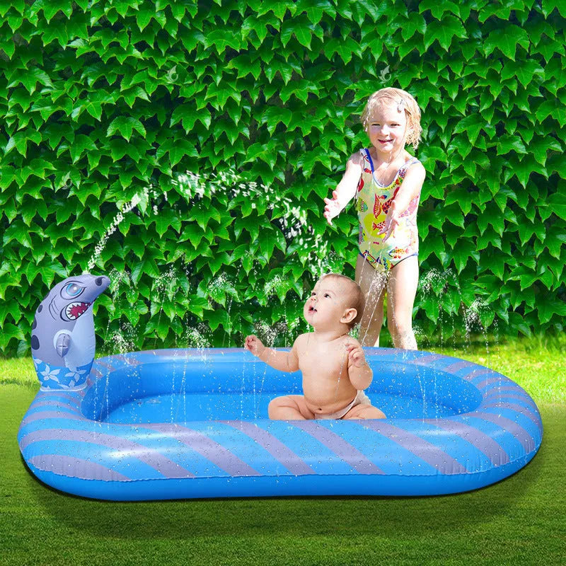 Large blue inflatable kids pool with dinosaur water spray and separate shark pool section