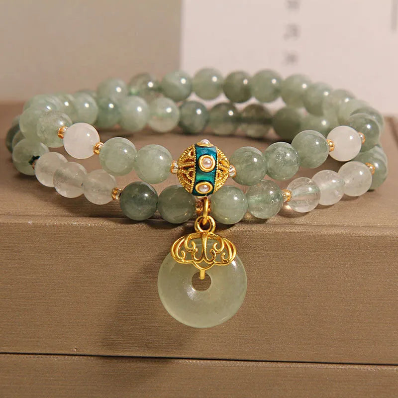 Women's double-layer aventurine jade bracelet with safety buckle and rhinestones.