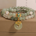 Women's double-layer aventurine jade bracelet with safety buckle and rhinestones.