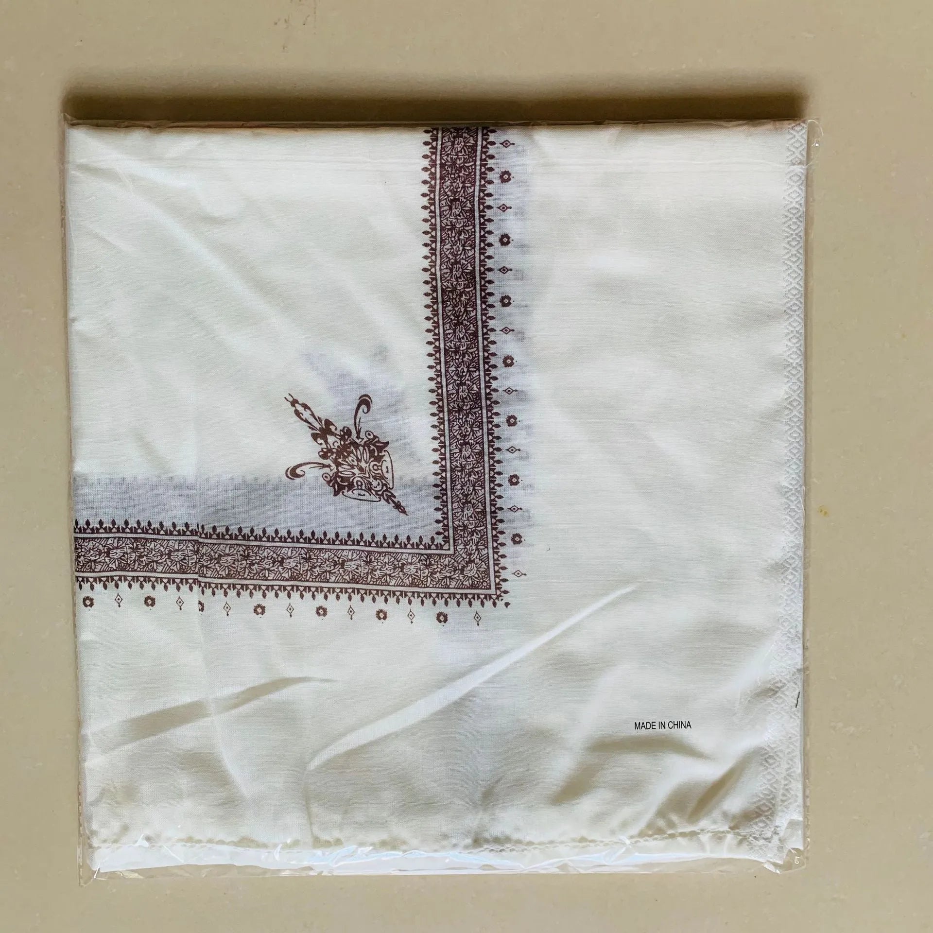 Printed square polyester scarf showing coffee colour option laid flat to display 138cm dimensions
