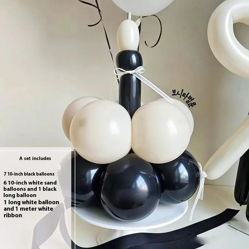 Finished round balloon bouquet decoration for cake table centrepiece.