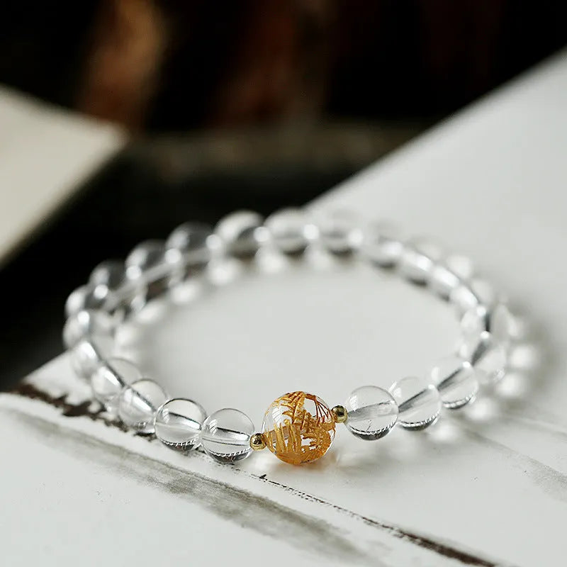 Geometric obsidian and white crystal beaded bracelet with golden dragon charm on adjustable band