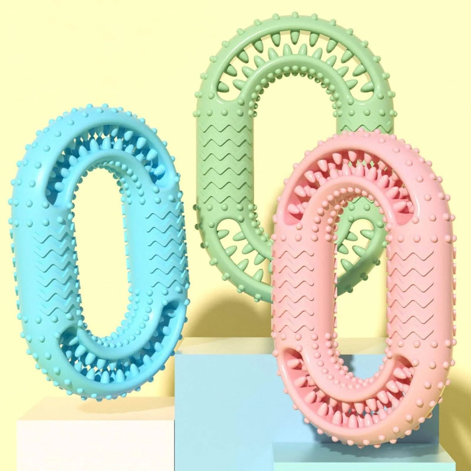 Blue, green, and pink heavy-duty o-ring shaped dog chew toy for aggressive chewers.