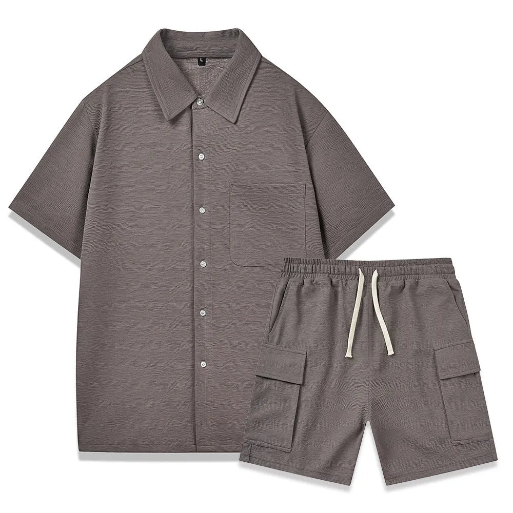 Beige polyester short sleeve top and elastic waist shorts two-piece set laid flat.