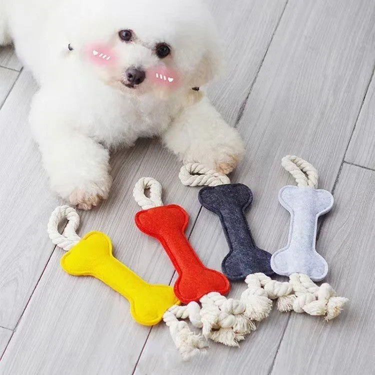 Bone-shaped dog chew toy in felt fabric with rope detailing, shown in various colours