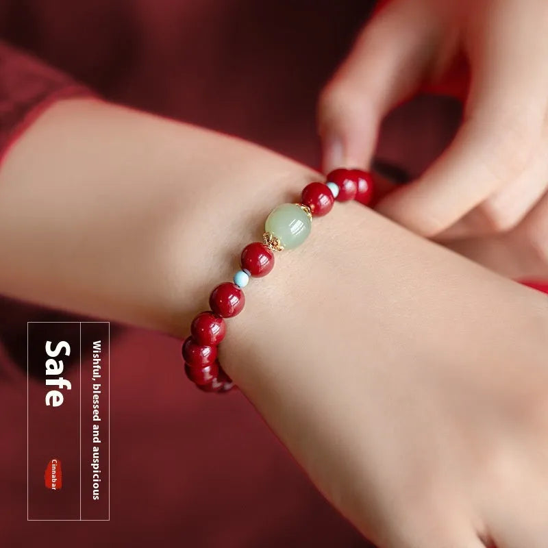 Cinnabar and coated metal geometric bracelet with elliptical beads in purple gold sand colour.