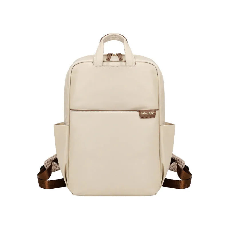 Large canvas travel backpack for women in apricot colour, showing front sandwich pocket and urban style.