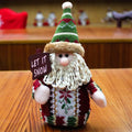 Three flannel Christmas snowman decorations in red, green and white colours