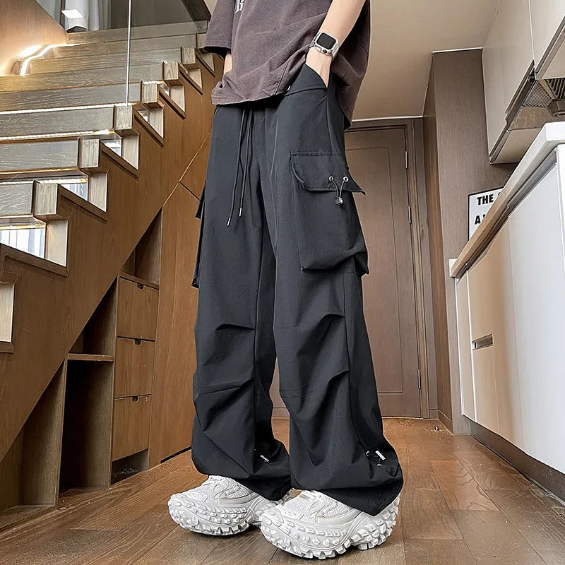 Plus size waterproof trousers in black straight-leg style with drawstring waist