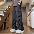 Plus size waterproof trousers in black straight-leg style with drawstring waist