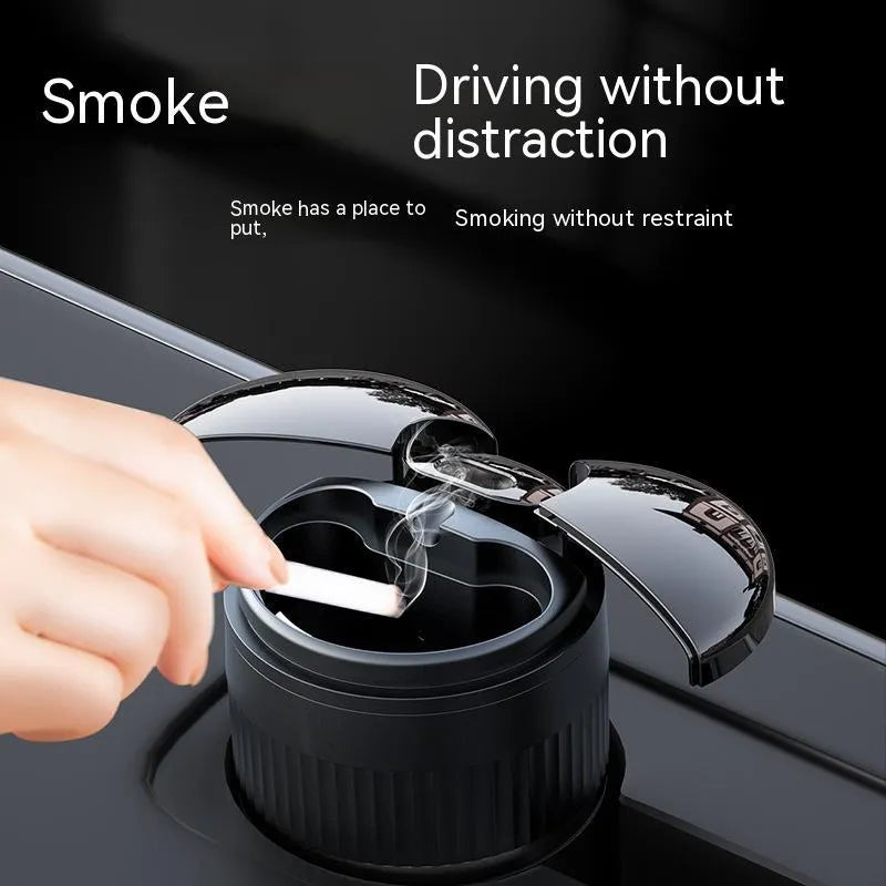 Black automatic infrared sensing metal car ashtray with lid on a car dashboard.