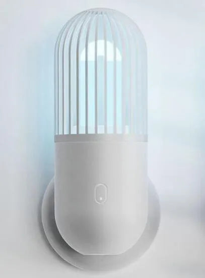 Portable capsule ultraviolet disinfection lamp in black, brown, green or white with compact 52x52x136mm body