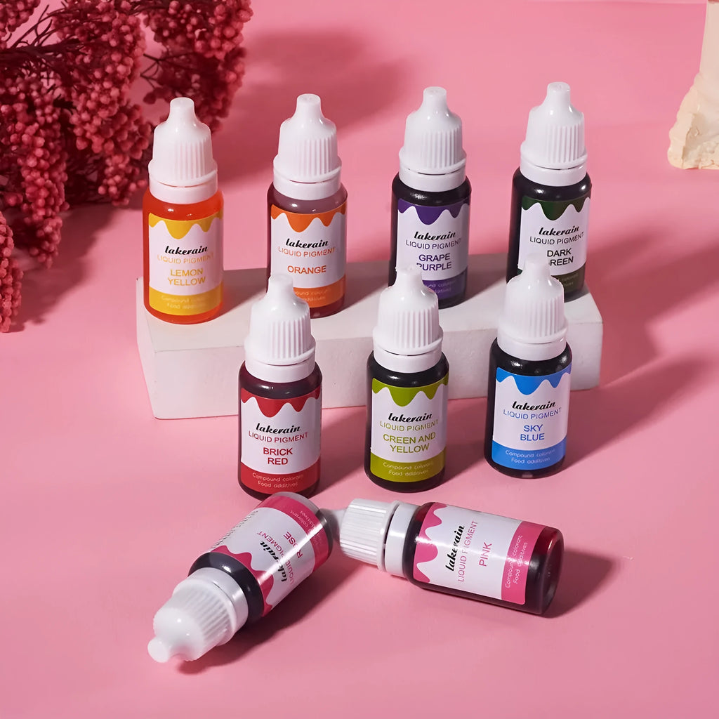 24 bottled soap pigments in rainbow colours with crafting tools and decorative accessories laid out