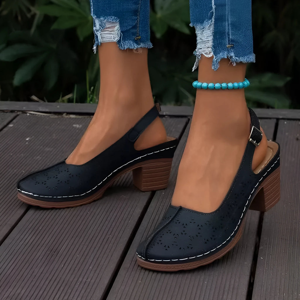 Women's black closed toe wedge sandals with round toe and rubber sole on a size label showing 36-43.