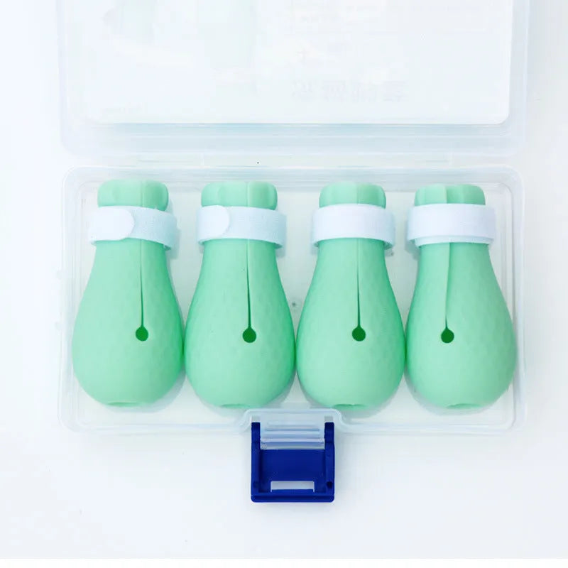 Four silicone cat foot covers designed to protect against scratches during pet care procedures