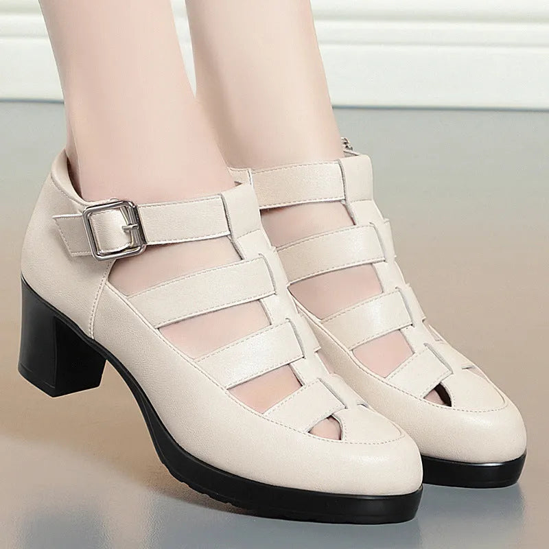 Women's beige closed toe sandals with chunky heel, woven pattern, buckle ankle strap, and back zipper.