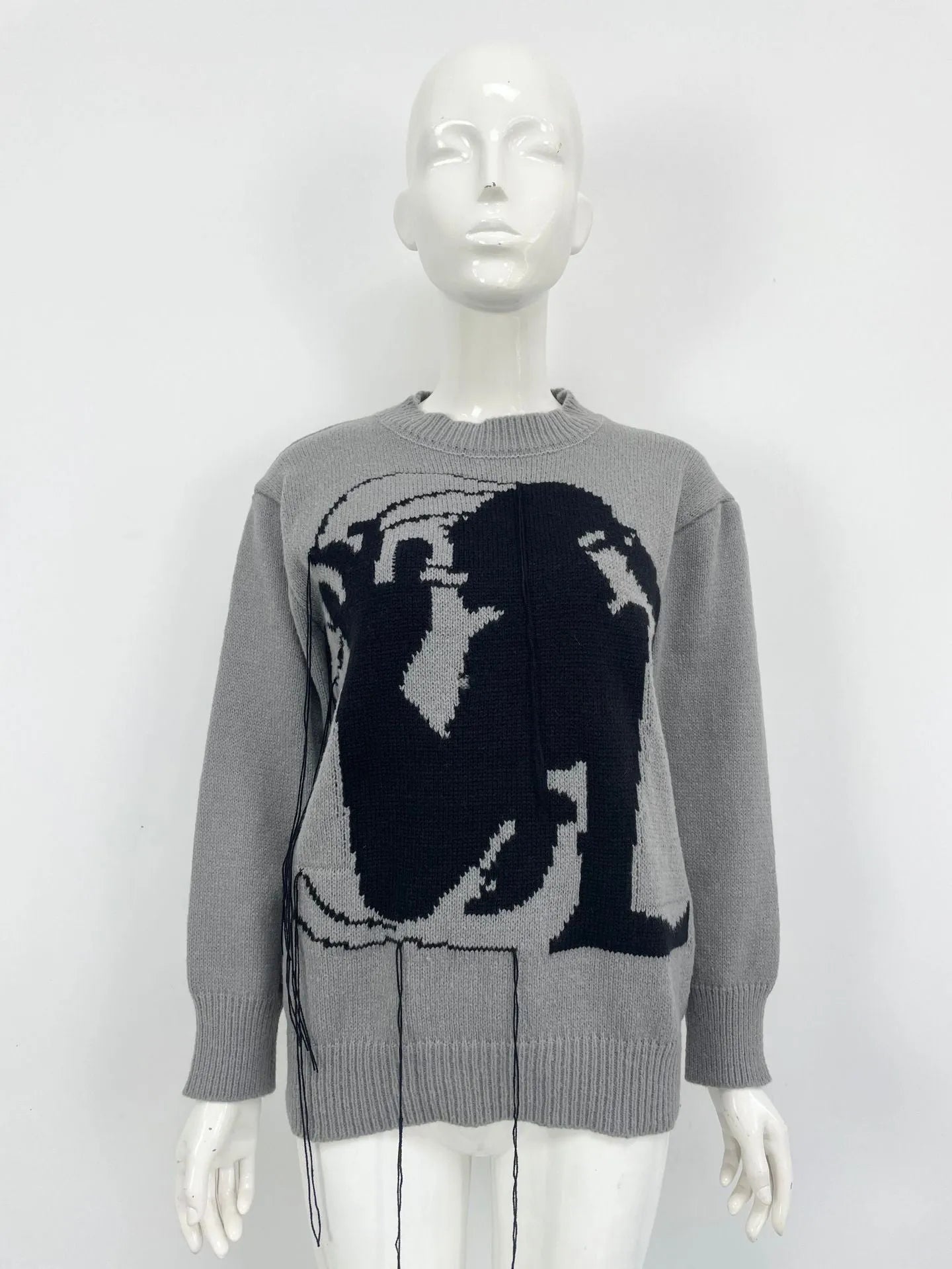 Women's loose fit alpaca wool sweater with tassel design and abstract pattern in street fashion style
