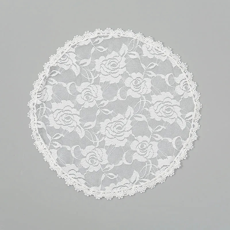 Round white floral bridal head cover decoration accessory on a 30cm background.