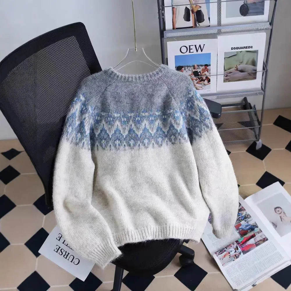 Women's thick jacquard knit sweater coat in a loose fit, shown in milky white colour with long sleeves.