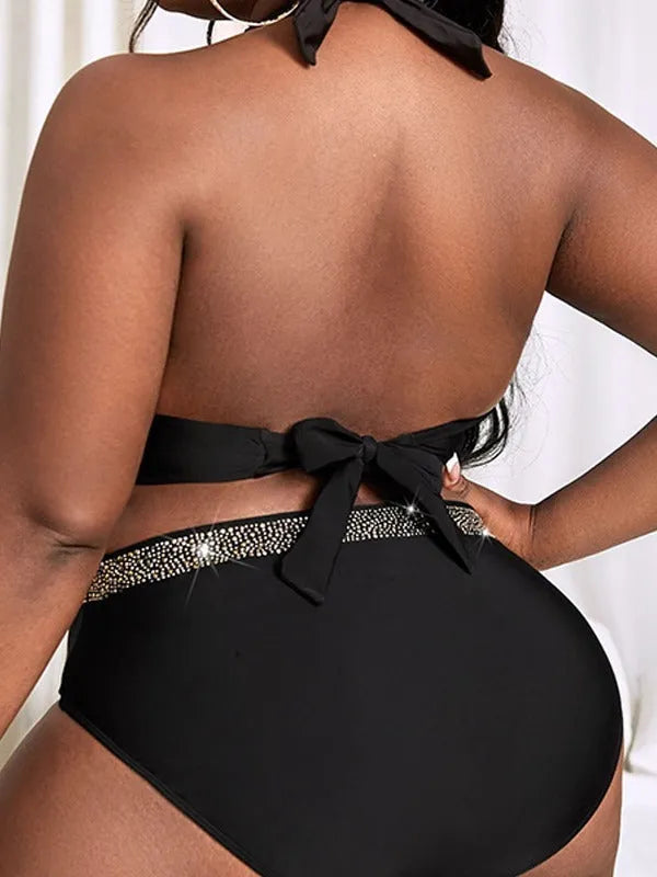 Black plus size women's bikini set with bra top and shorts on a mannequin.