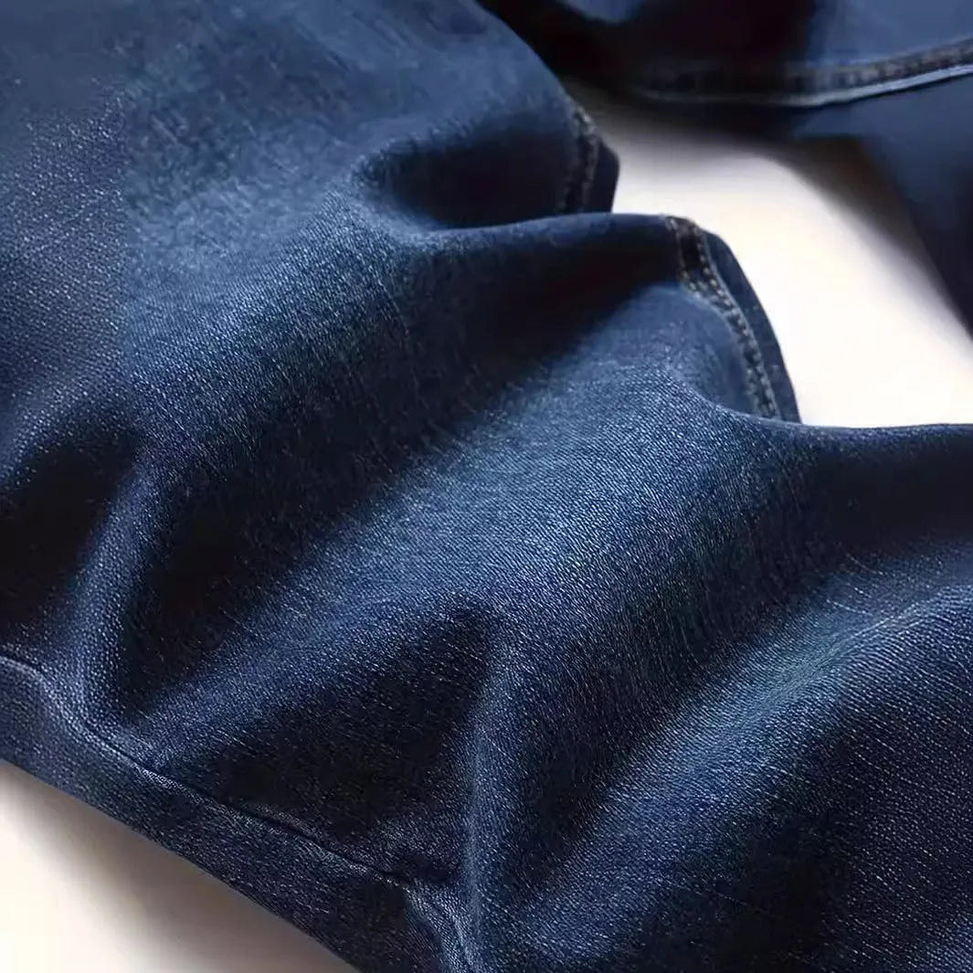 Men's dark blue slim fit casual jeans with a skinny leg and zip fly closure