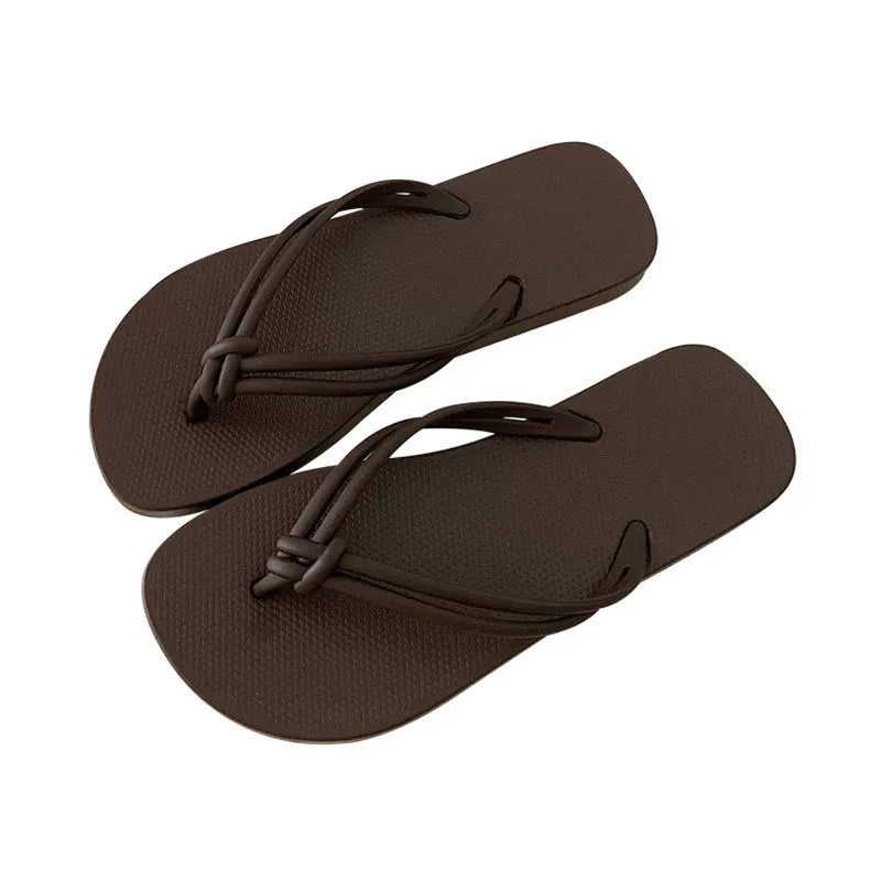 Women's PVC flip flops with toe-covering style and non-slip sole in multiple colours.