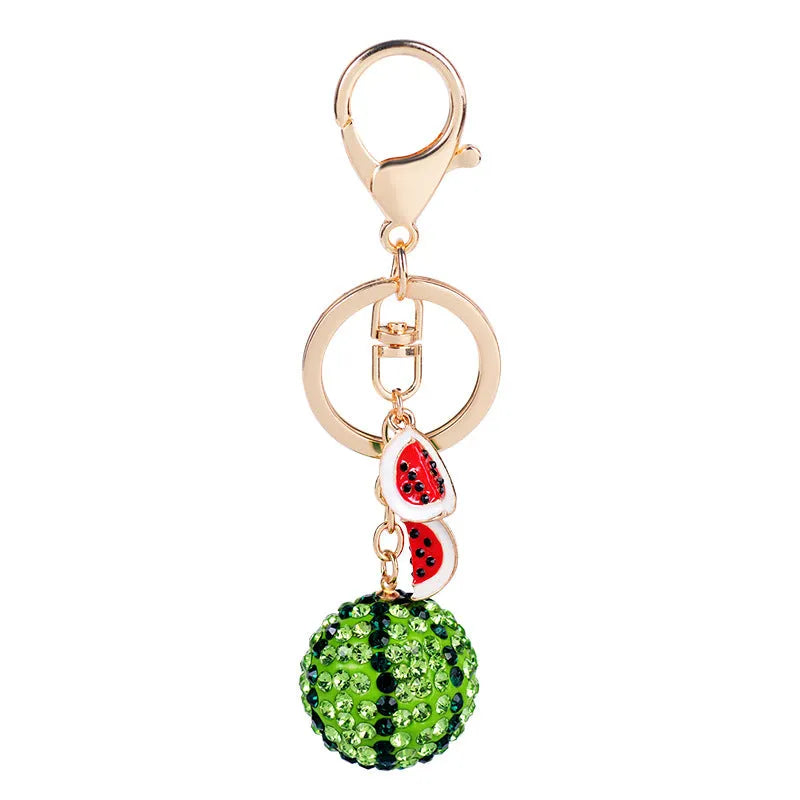 Green zinc alloy watermelon slice keychain on a white background