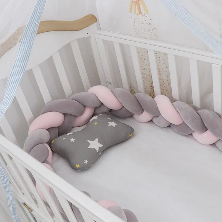 Braided knot crib bumper in spandex velvet, showing flexible length options for cot protection.