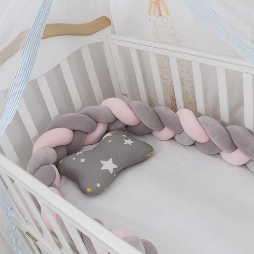 Braided knot crib bumper in spandex velvet, showing flexible length options for cot protection.