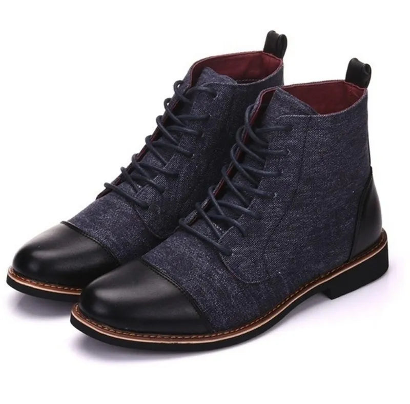 Men's black leather motorcycle-style ankle boots with belt buckle and rubber sole.