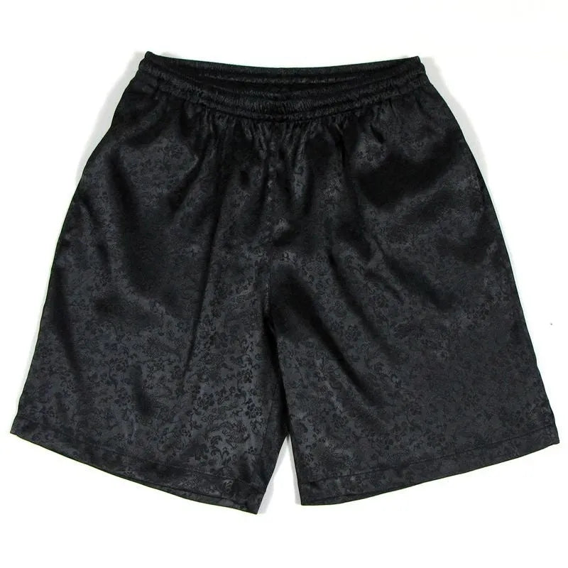 Men's black Tang Suit shorts with an elastic drawstring waistband, shown flat.