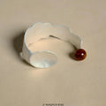 Silver-toned electroplated alloy ring and bracelet set with diamond shape design