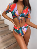 Red women's printed split swimsuit with triangle bikini briefs for swimming and surfing.