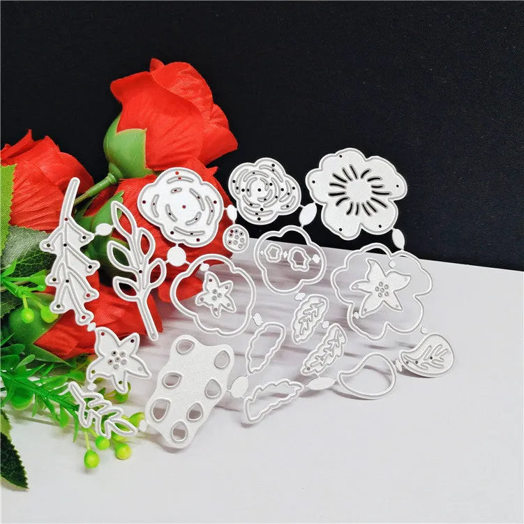 Silver carbon steel craft die with etched flower design for paper cutting, measuring 14.3 by 9.9 cm.