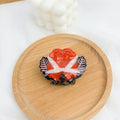 Halloween hair clip with shark and vinegar bat design in four style options