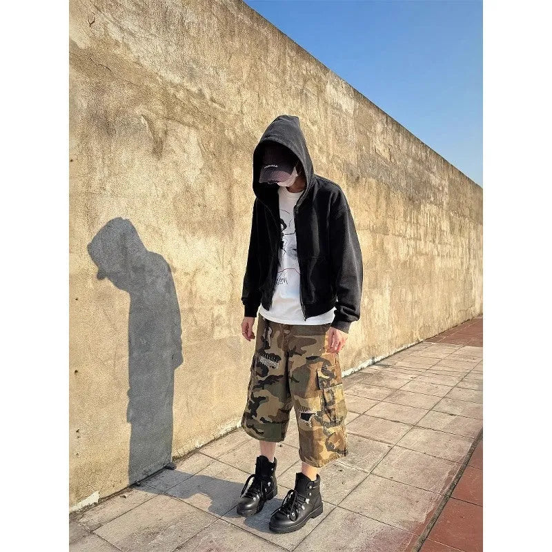 Men's camouflage cropped jeans with patch detailing and ripped accents in straight leg style