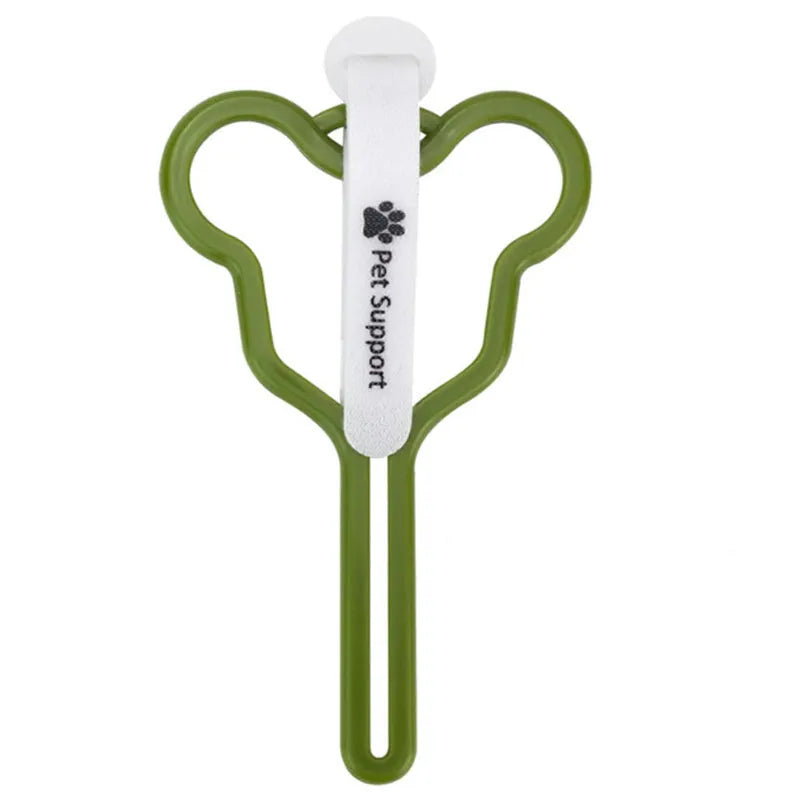 Hands-free dog poop bag holder with black velcro strap and clip attached to a dog leash.