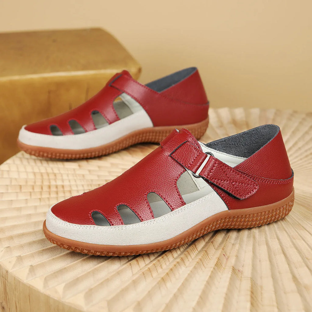 Women's plus size blue flat sandals with a hollow-out toe cap and thick rubber sole.
