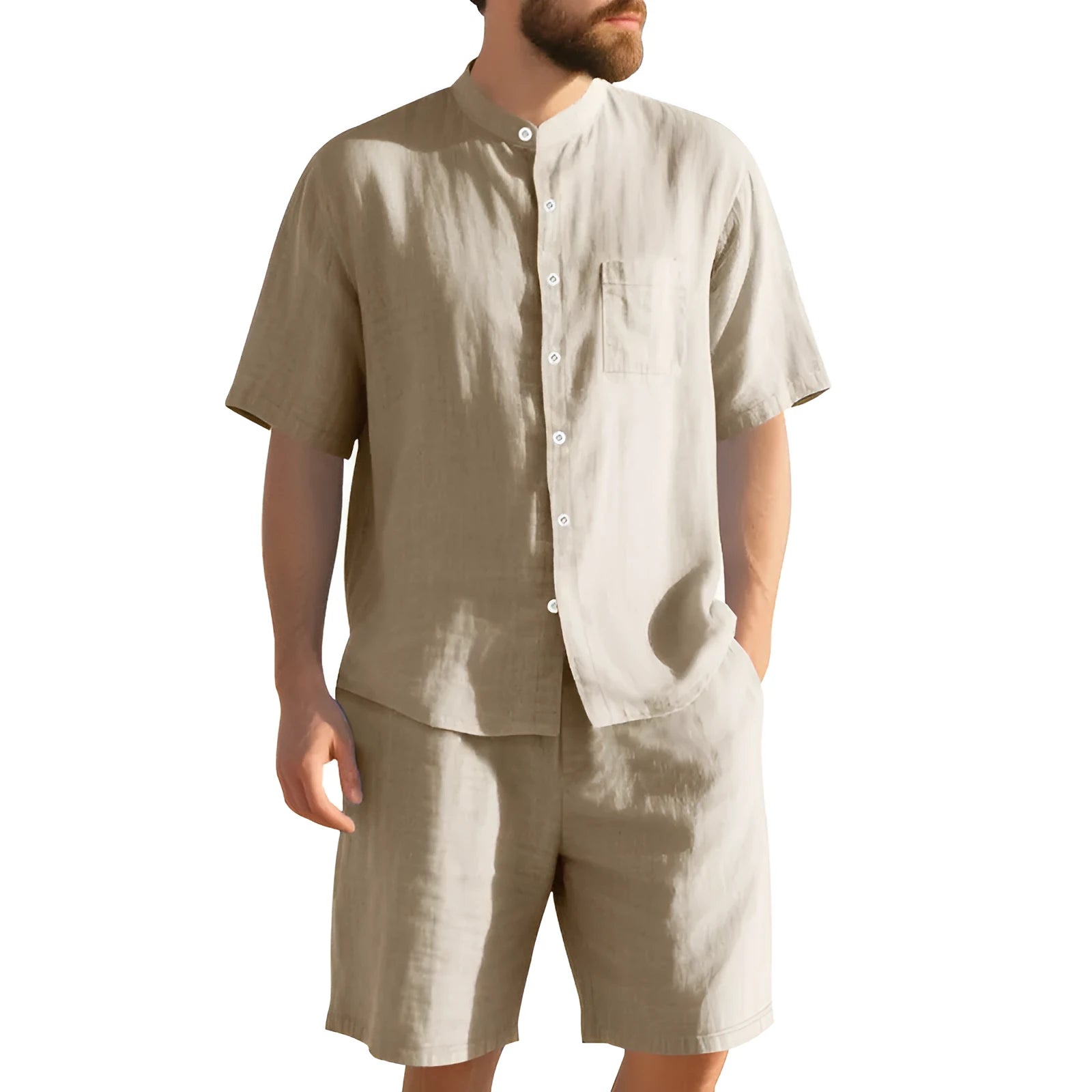 Man wearing a light blue short-sleeve linen blend suit jacket and matching shorts with a Henry collar.