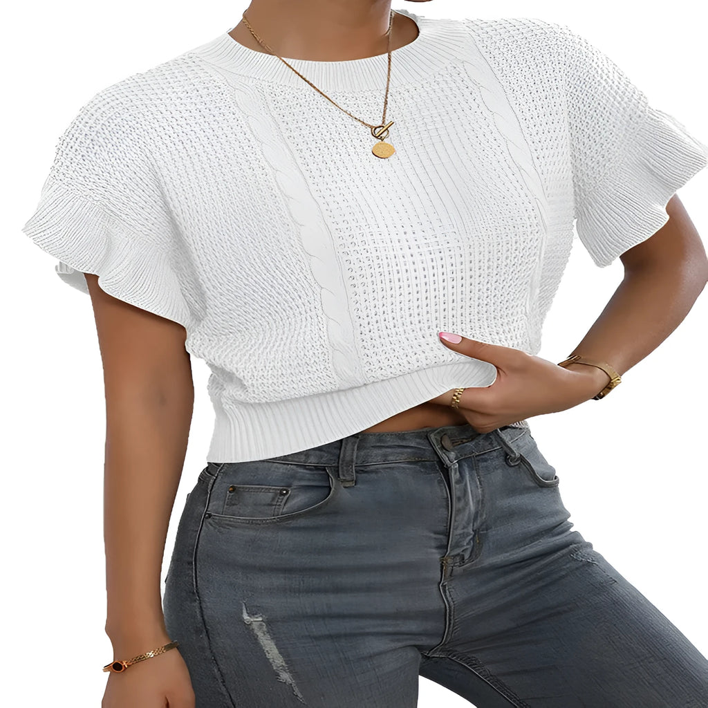 White loose knitted women's pullover sweater with ruffled short sleeves and a textured 3D pattern.
