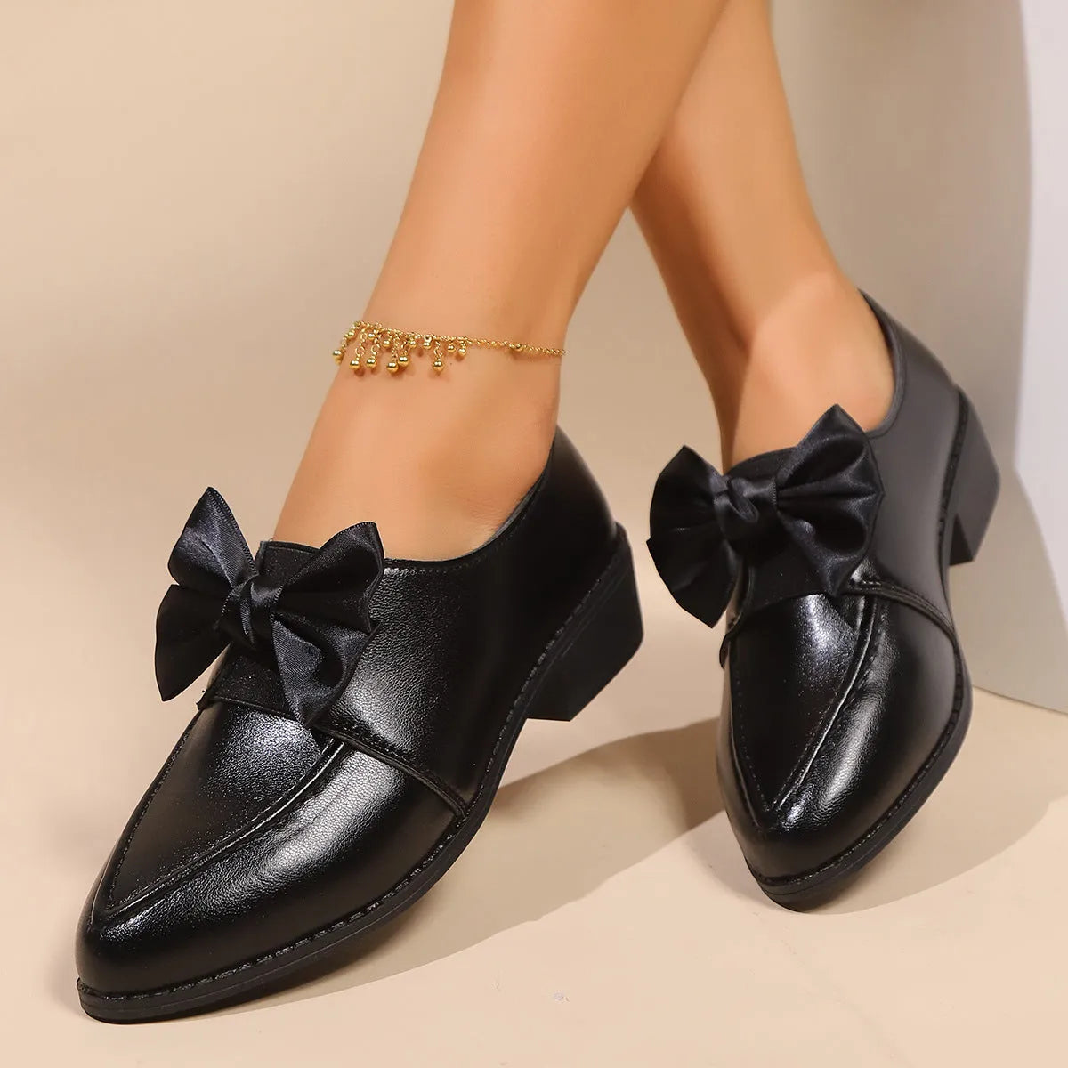 Women's British-style leather shoes with decorative bow on pointed toe, available in three bow style variations