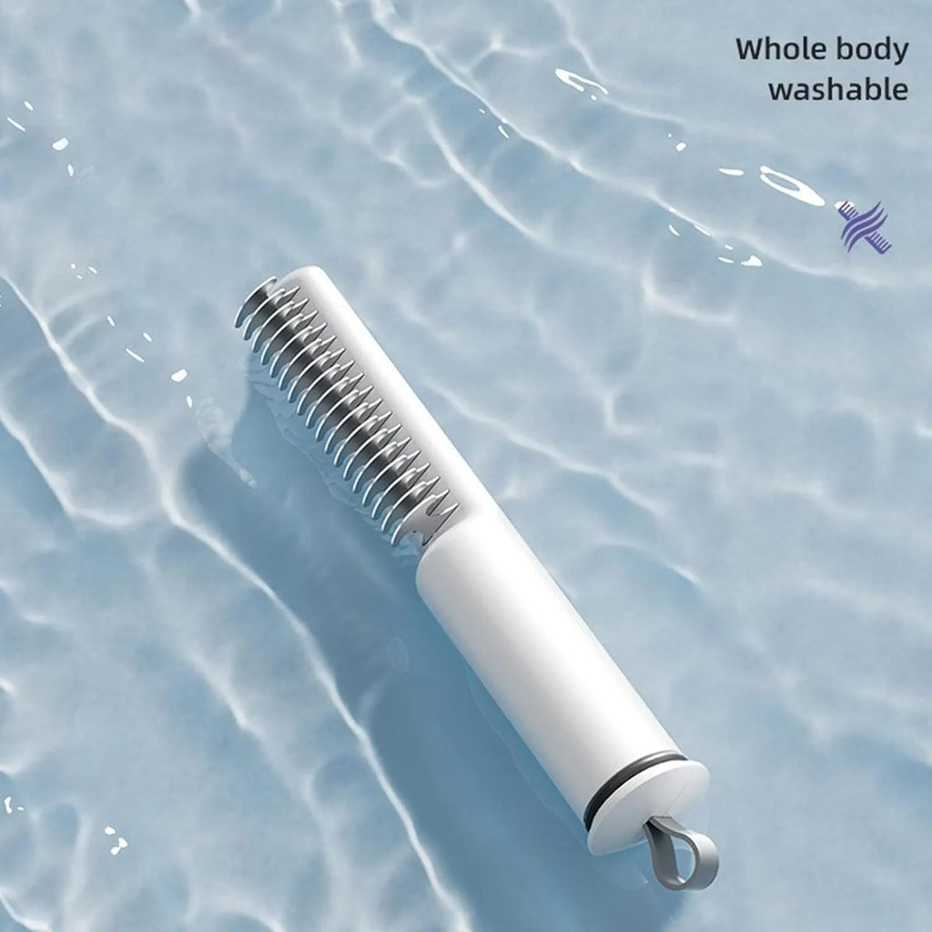 Stainless steel dog dematting comb with ergonomic handle on a white background