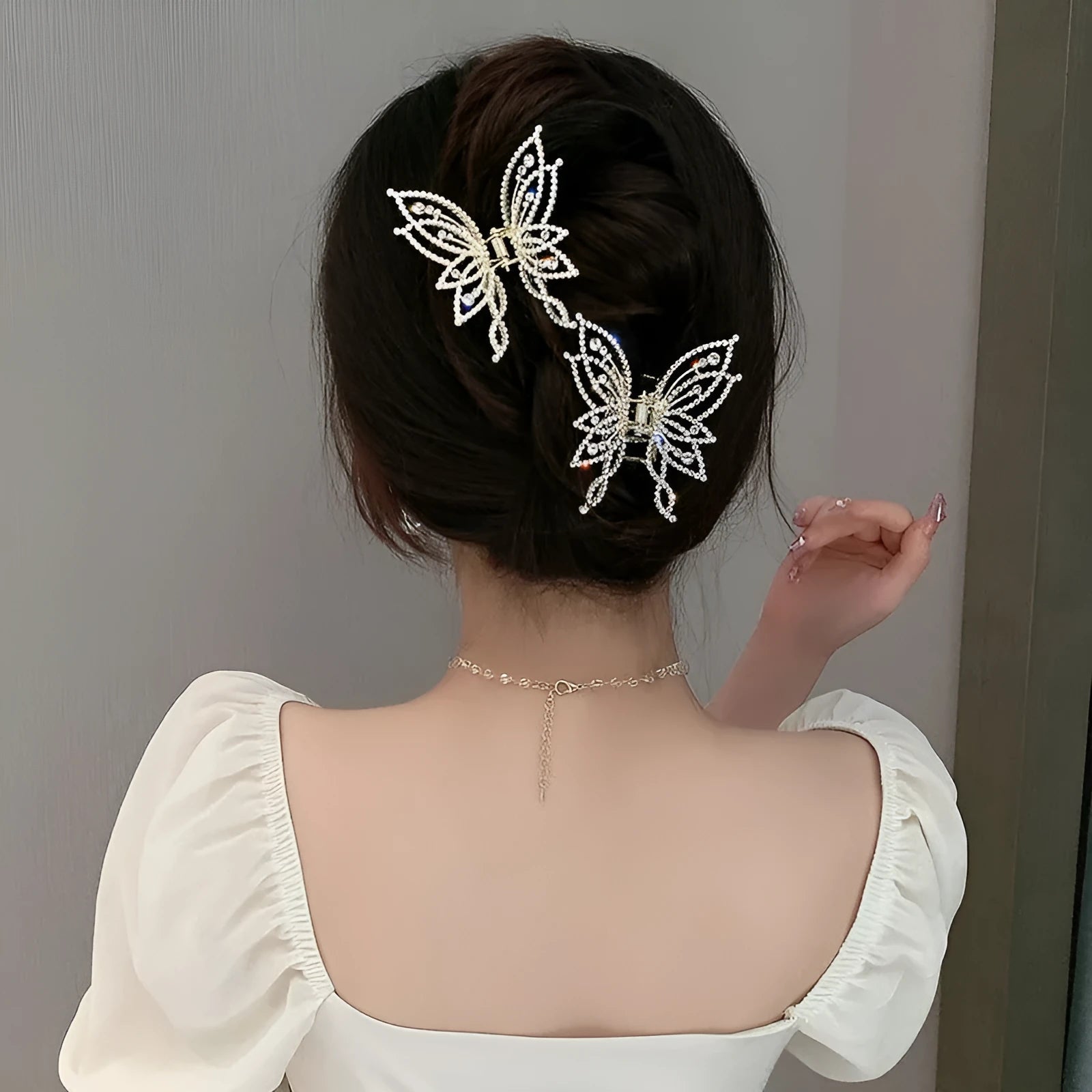 Butterfly hair barrettes in alloy measuring 6.7 by 6.2 cm with decorative elements