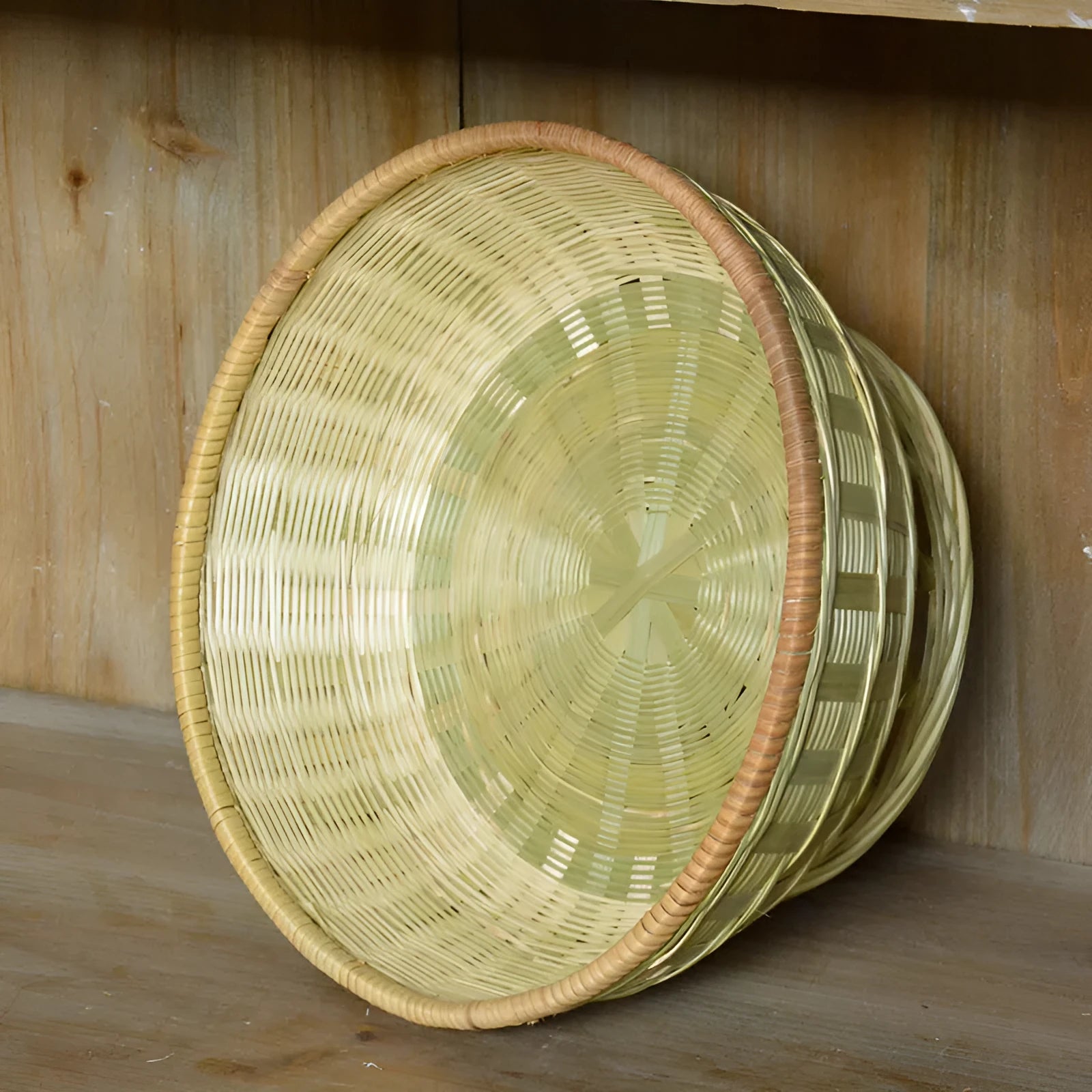 Handmade natural bamboo storage basket set showing three different sizes for household organisation