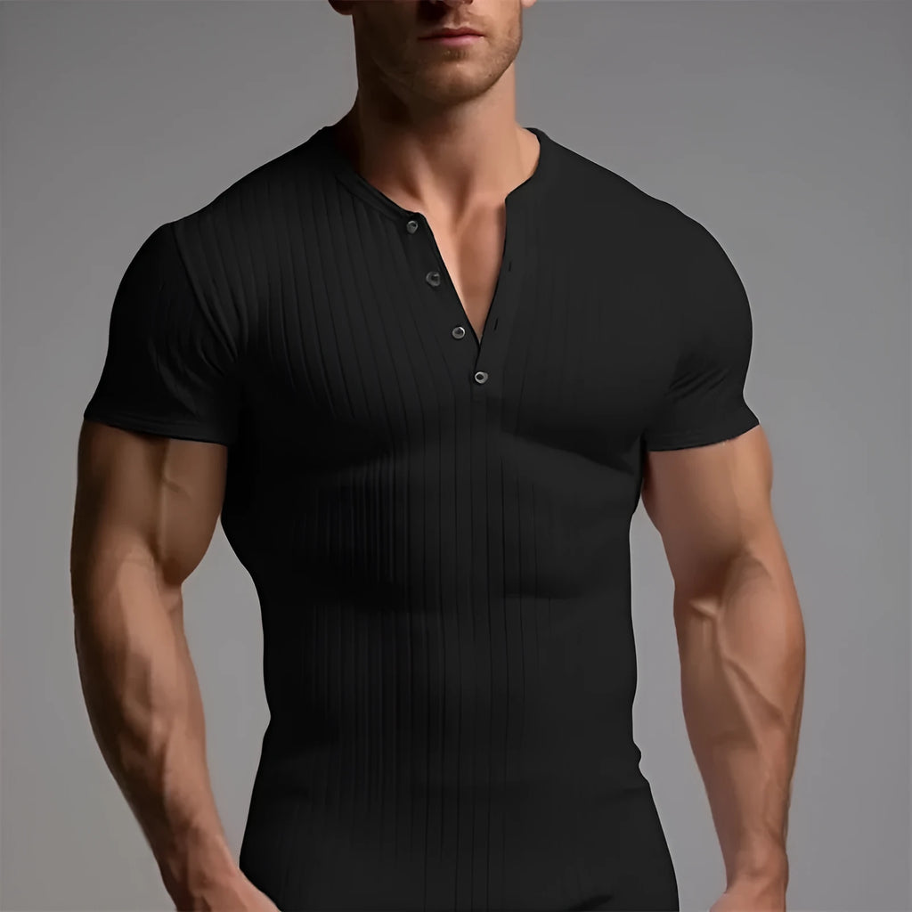 Man wearing a slim-fit solid colour polyester sports t-shirt in a muscle tee style.