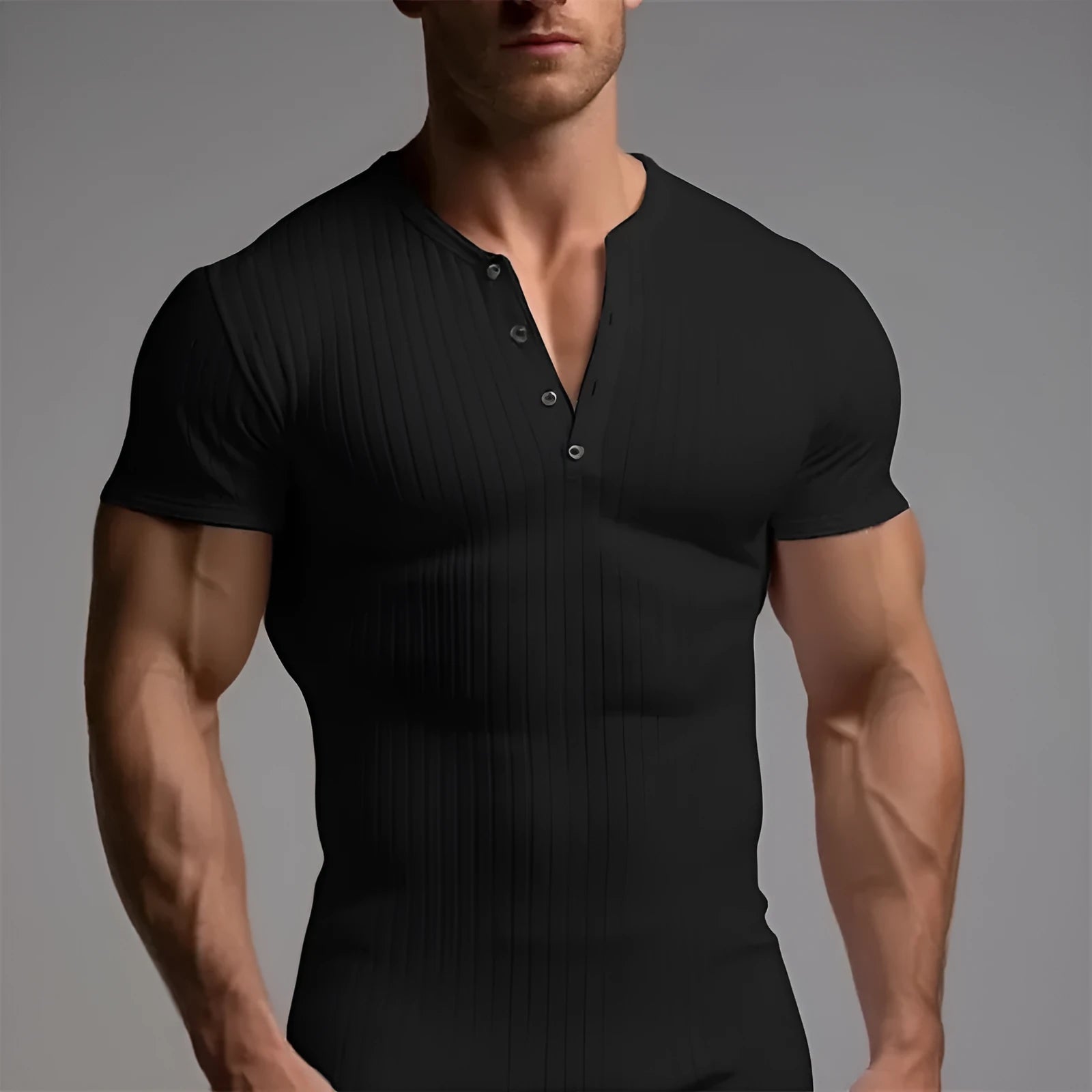Man wearing a slim-fit solid colour polyester sports t-shirt in a muscle tee style.