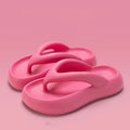 Solid colour thick-soled EVA flip-flops with a bow on the strap, shown on a white background.