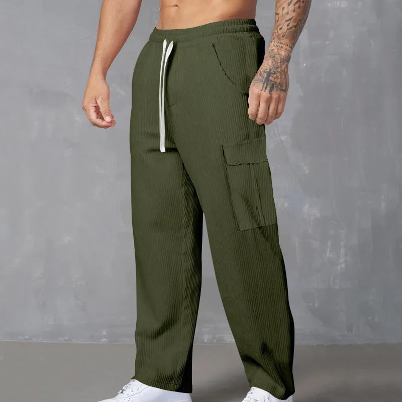 Men's loose-fitting corduroy cargo trousers in navy blue with straight wide-leg cut and elasticated waist